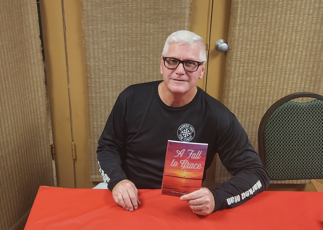 Capt. Michael Ball with his book 